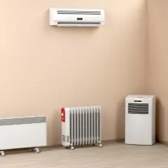 Soluciones para instalar calefacción sin obras: radiadores eléctricos, un split y un calefactor portátil en una habitación.