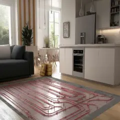 Instalación de suelo radiante aerotermia en una cocina moderna con sofá y ventanas amplias.