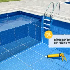 Piscina con escaleras y pistola de masilla, lista para impermeabilizar piscina con mortero.