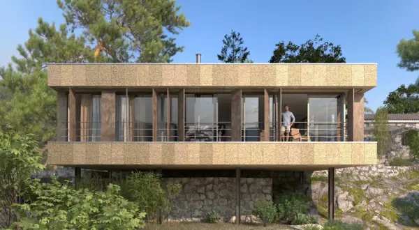 Fachadas exteriores de casas modernas con amplios ventanales y balcón, integradas en un entorno natural rocoso y arbolado.