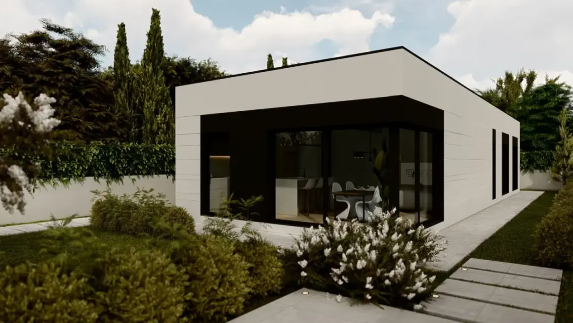 Casa moderna de construccion modular con amplios ventanales y jardín exuberante.